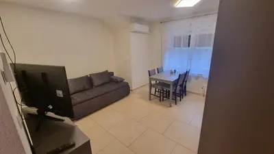 a living room with a couch and a table at Apartma Danica in Kobarid