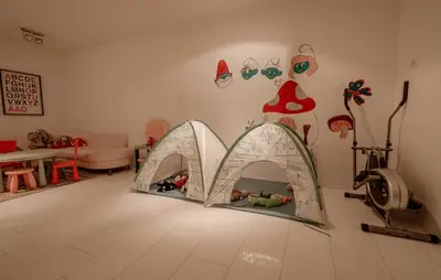 a living room with a play house in the floor at Apartments Eurolux - Bohinjska Bistrica in Bohinj