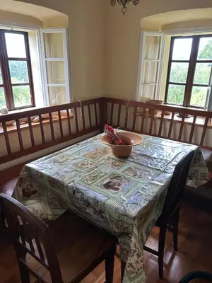 a table with a bowl on top of it at Hiša p'r Kobalu- in Idrija