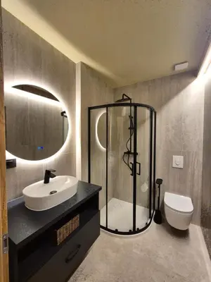 a bathroom with a shower and a sink and a toilet at Mega Apartmaji in Rogaška Slatina