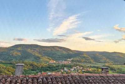 a view of a town in a valley with mountains at Hiša Margarita in Ajdovščina