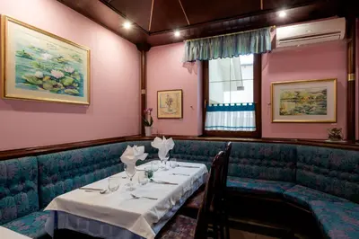a dining room with a table in a restaurant at Hotel Florjančkov Hram in Ljubljana