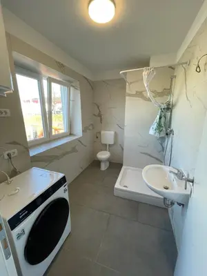 a small bathroom with a sink and a toilet at VP sobe in Ilirska Bistrica