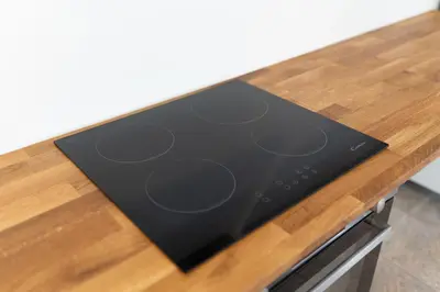 a stove top oven sitting on top of a wooden counter at BIG DUPLEX Terrace FREE PARKING City Center in Ljubljana