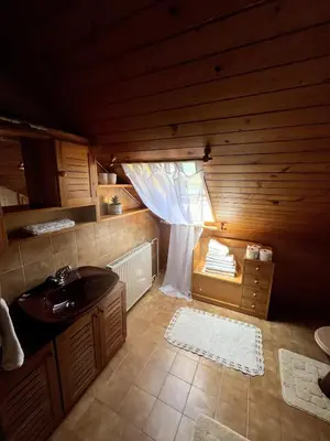 a bathroom with a sink and a window in a cabin at Bled Lakeview Apartment Elizabeth in Bled