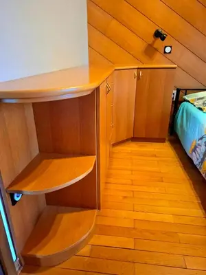 a room with a wooden shelf and a bed at Rooms Lublana in Ljubljana