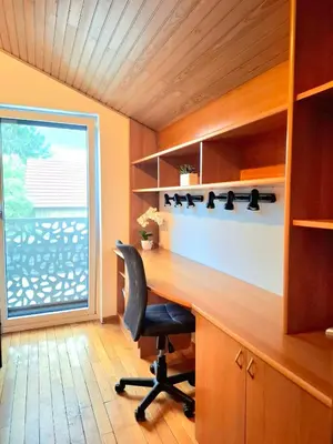 a home office with a desk and a chair at Rooms Lublana in Ljubljana