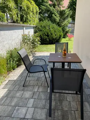 a table and chairs sitting on a patio at Apartma Tomy in Domžale
