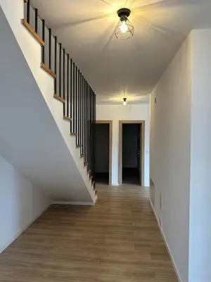 a hallway with a staircase in a house at Vila Altura- Luxury Hiltop Retreat with Panoramic View & Teracce in Rogaška Slatina