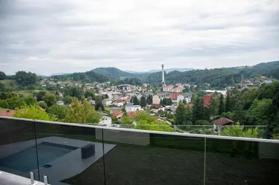 a view of a city from the balcony of a house at Vila Altura- Luxury Hiltop Retreat with Panoramic View & Teracce in Rogaška Slatina