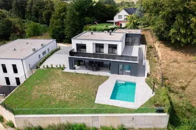 an aerial view of a house with a swimming pool at Vila Altura- Luxury Hiltop Retreat with Panoramic View & Teracce in Rogaška Slatina
