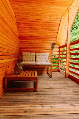 a sauna with a bench and a couch in it at Apartma BoMa in Bovec