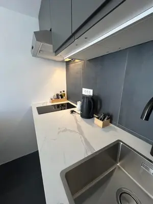 a kitchen with a sink and a counter top at K-12 Loft Apartments in Ljubljana