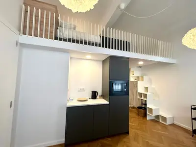 a kitchen with a loft bed in a room at K-12 Loft Apartments in Ljubljana