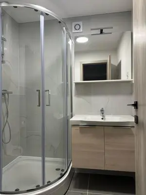 a bathroom with a shower and a sink at Apartma Center Ljutomer in Ljutomer