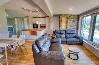a living room with a couch and a table at Apartma Mars in Brest