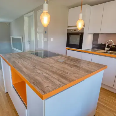 a kitchen with a large wooden counter top at Apartma Mars in Brest