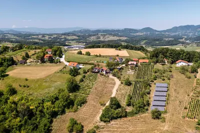 an aerial view of a farm with crops at Holiday House Konuško in Šmarje pri Jelšah