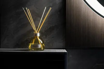 a bottle of oil with sticks in it on a table at Apartmaji na Pošti in Podsreda