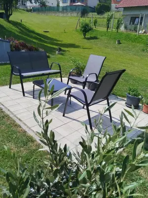 a couple of chairs sitting on a patio at APARTMA BriGITA in Gorica pri Slivnici