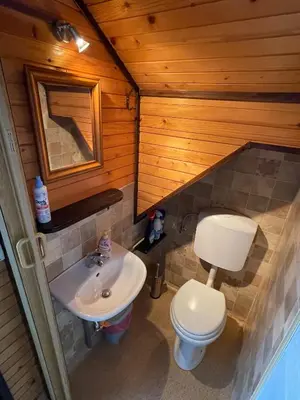 a bathroom with a toilet and a sink at Apartma ob Kolpi Križan in Gradac