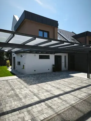 a house with a large open garage at Modern Stay House Ptuj in Ptuj