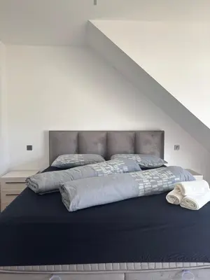 a large bed in a room with at Modern Stay House Ptuj in Ptuj