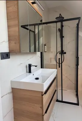 a bathroom with a sink and a shower at Modern Stay House Ptuj in Ptuj