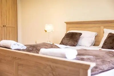 two beds sitting next to each other in a bedroom at Hiša Elsbacher Laško in Laško