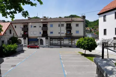 an empty parking lot in front of a building at Hiša Elsbacher Laško in Laško