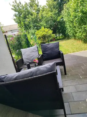 a couple of benches sitting on a patio at Apartma Lastovka in Moravske Toplice