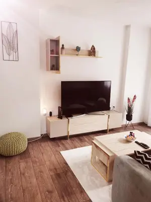 a living room with a large flat screen tv at ONYX Apartments in Ljubljana