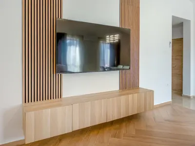 a living room with a television on a wall at Apartment Adelsberg Inn-1 by Interhome in Postojna