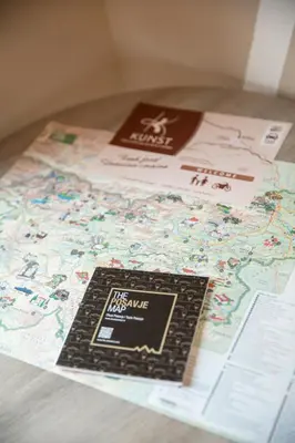a book sitting on top of a map at Garni Hotel Krško in Leskovec pri Krškem