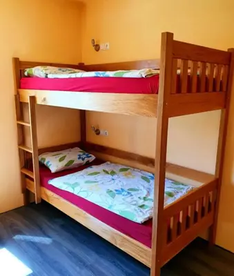 two bunk beds in a small room with at Bled Hostel II in Bled