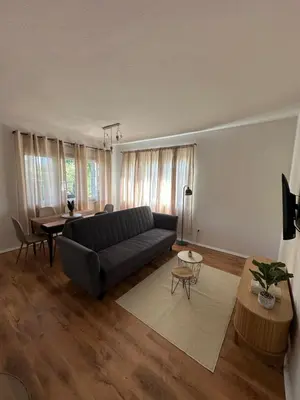 a living room with a couch and a table at Toni's house in Bled