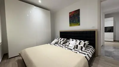 a bedroom with a large bed with pillows on it at Pri Drevoredu in Prvačina