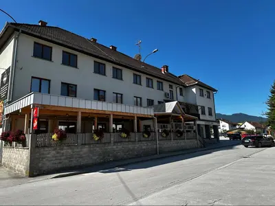 a large building on the side of a street at Gostilna Menina in Gornji Grad