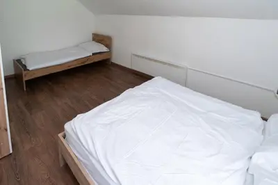 a small room with a bed and a mattress at Hiša pod Veliko planino in Stahovica