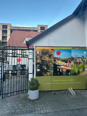 a building with posters on the side of it at My Star Apartment in Maribor