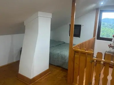 a bedroom with a bed and a window at DATA Bivalni vikend in Gruškovec