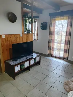 a living room with a large flat screen tv at DATA Bivalni vikend in Gruškovec