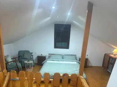 a bedroom with a bed in a attic at DATA Bivalni vikend in Gruškovec