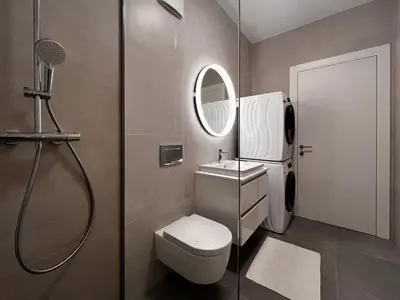 a bathroom with a shower and a toilet and a sink at Studio Lumee in Ljubljana