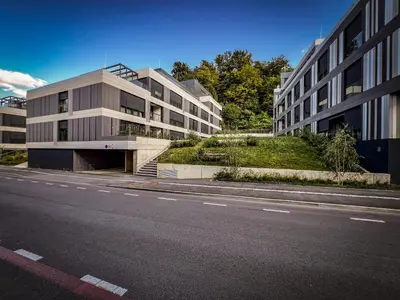 an empty street in front of a building at Studio Lumee in Ljubljana