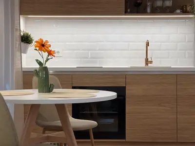 a kitchen with a table and a vase with a flower at Studio Lumee in Ljubljana