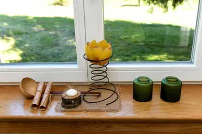 a vase with a yellow flower sitting on a table at Forest House Henriette in Ig