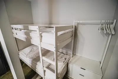 a white closet with white shelves and white sheets at Cankar's Private Place The Luxe in Ljubljana
