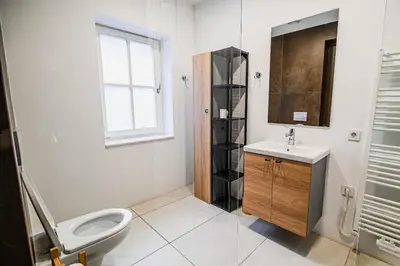 a bathroom with a toilet and a sink at Cankar's Private Place The Luxe in Ljubljana