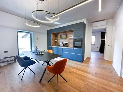 a kitchen and dining room with a table and chairs at Eipprova deluxe apartment in Rove
